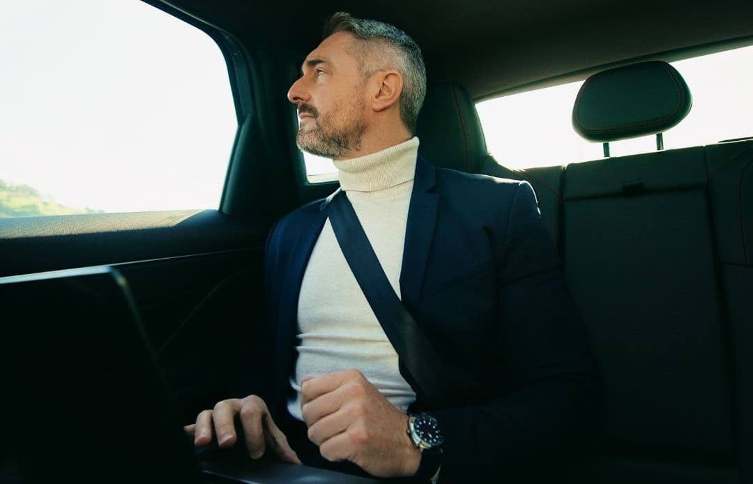 business man in back of car