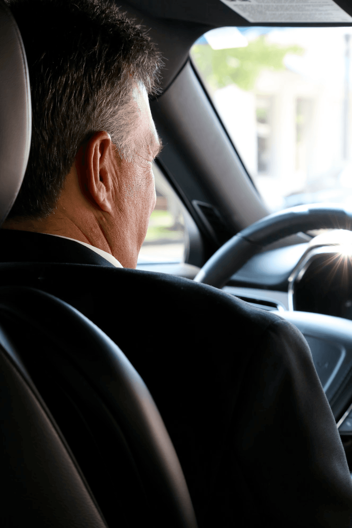 LUXY chauffeur driving passenger