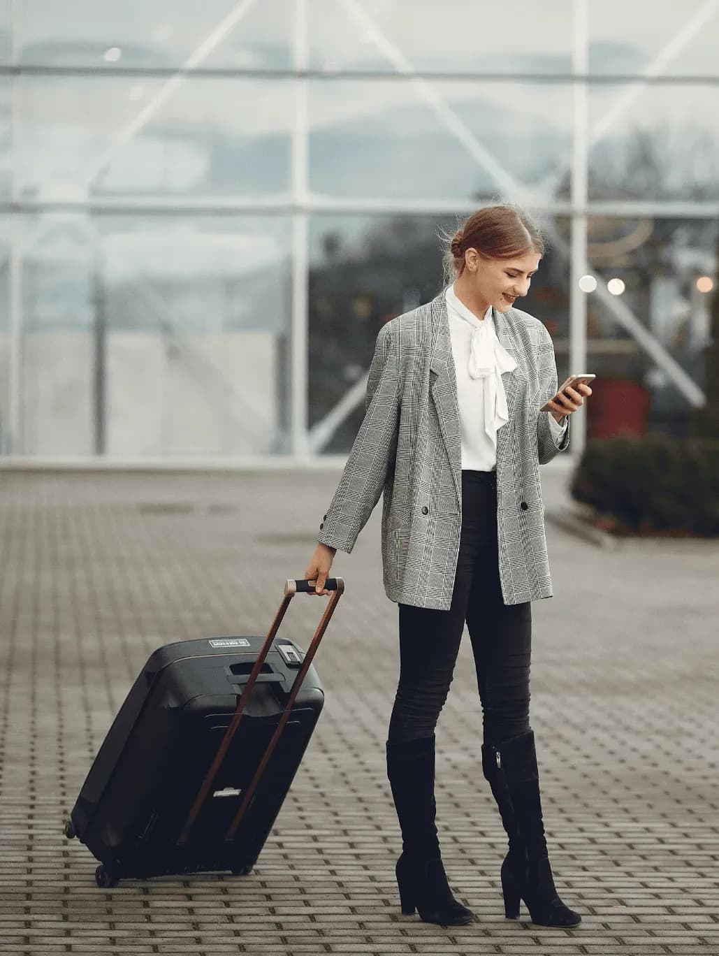 women on phone at the airport