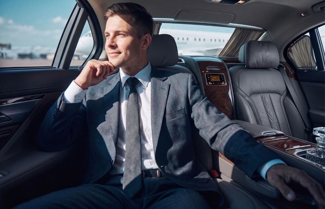 young man in back of car