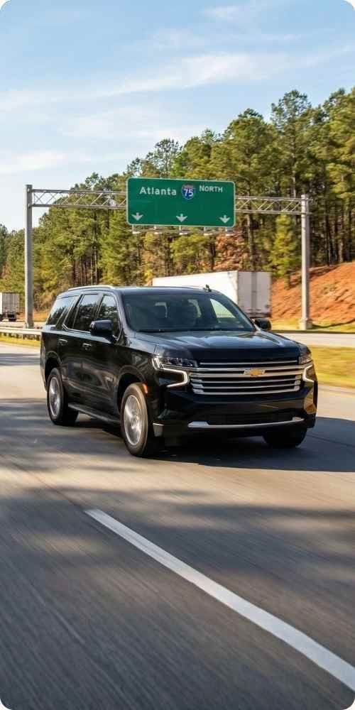 Black car SUV traveling to the Masters Tournament - mobile