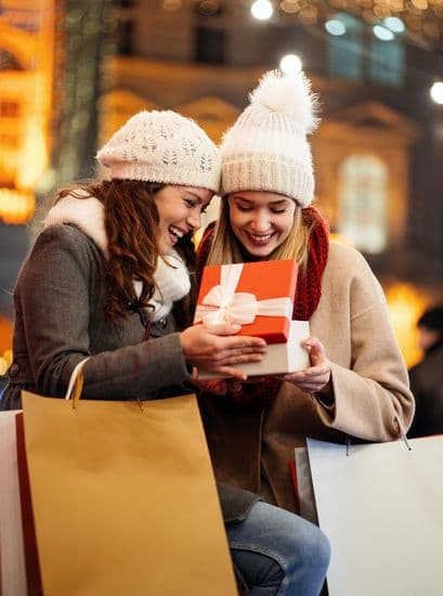Holiday Shopping Car Service 2026 Ladies With Shopping Bags in Cold Weather Clothing