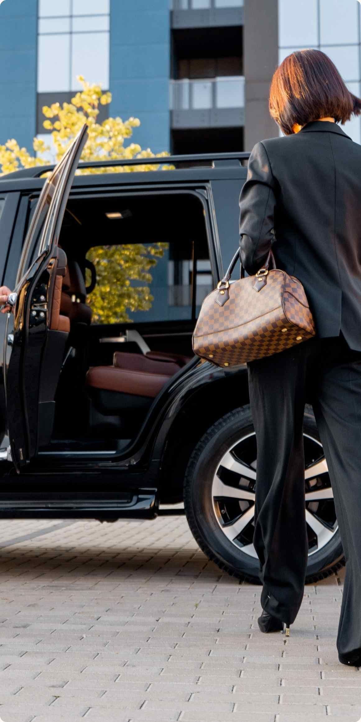 Passenger getting into luxury transfer