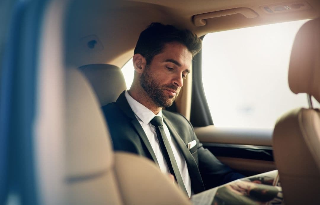 man in back of the car working