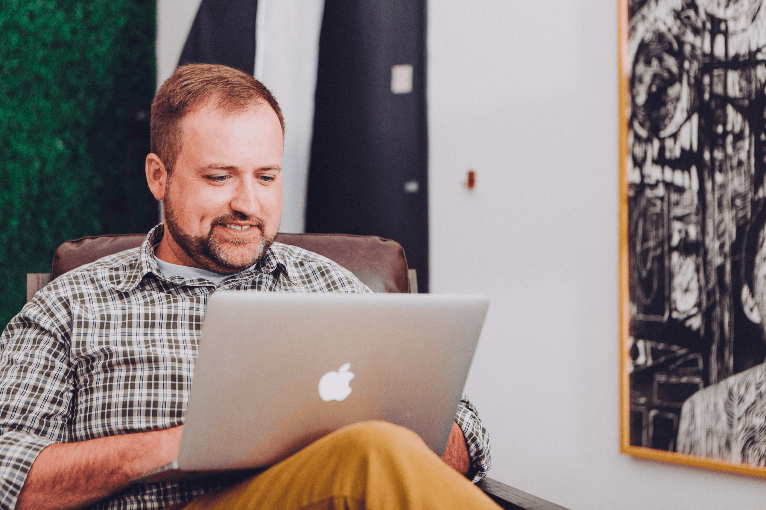 Travel agent booking a ride on a laptop