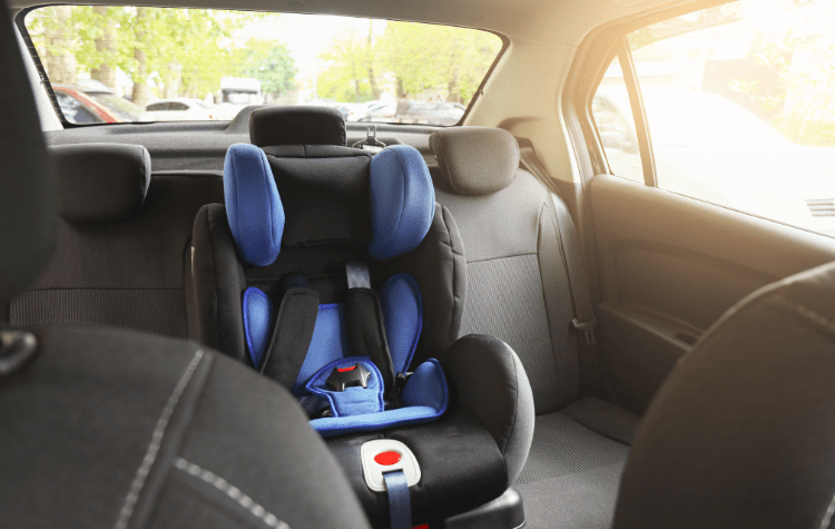 A child seat in the back of a car
