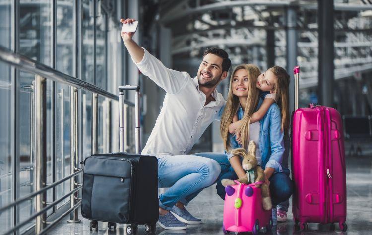 Family taking a selfie in the airport