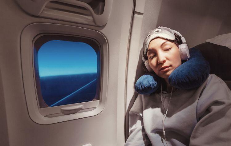 Passenger trying to sleep on a plane