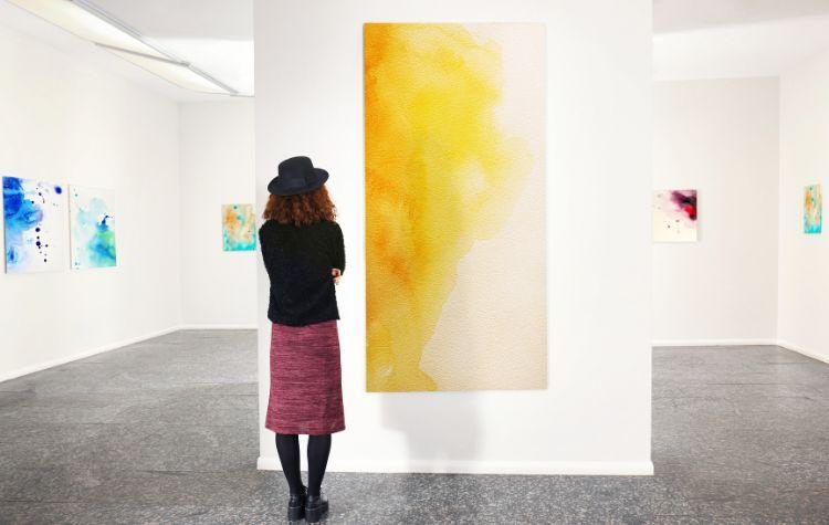 Person appreciating art at a gallery