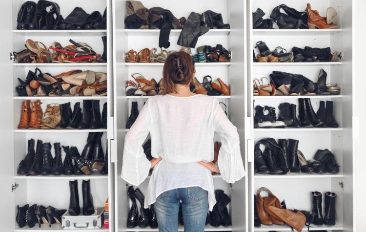 Person in closet choosing shoes