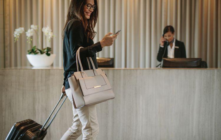 Woman traveling, arriving at a hotel